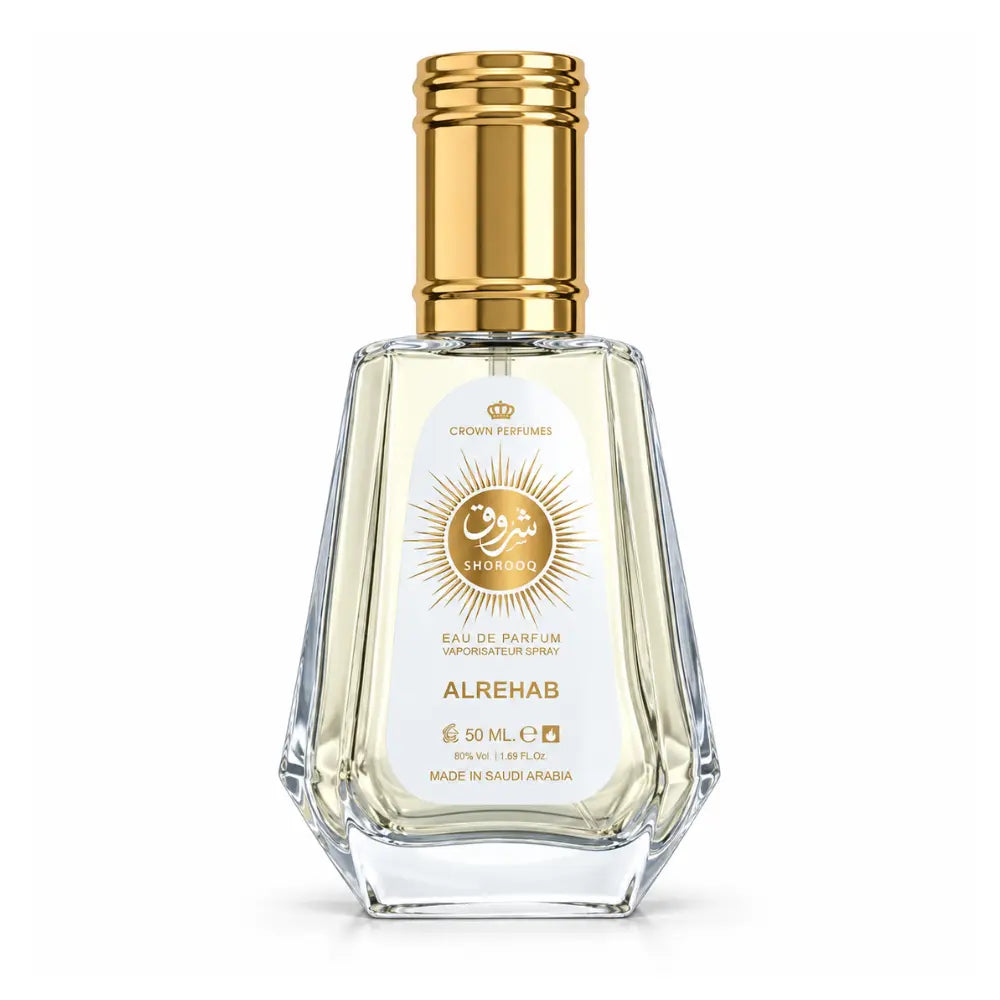 A 50 mL bottle of Crown Perfumes Alrehab Shorooq Eau de Parfum, featuring a clear faceted glass bottle with pale yellow liquid, a white label with gold details, and a metallic gold cap, set against a plain white background.
