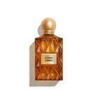  Citrine Amber perfume bottle with gold cap on a white background