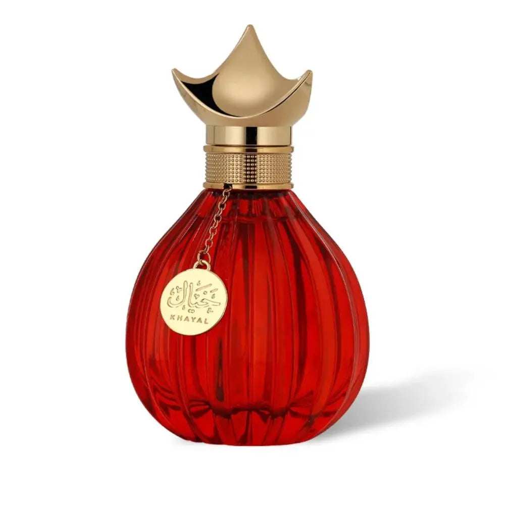 Khayal perfume in a red ribbed glass bottle with ornate gold cap on white background