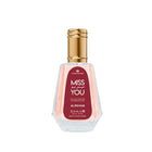 Miss You perfume by ALREHAB with pink fragrance and gold cap on white background