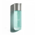Perfume Arrogate Comete with silver cap and light blue liquid on a white background