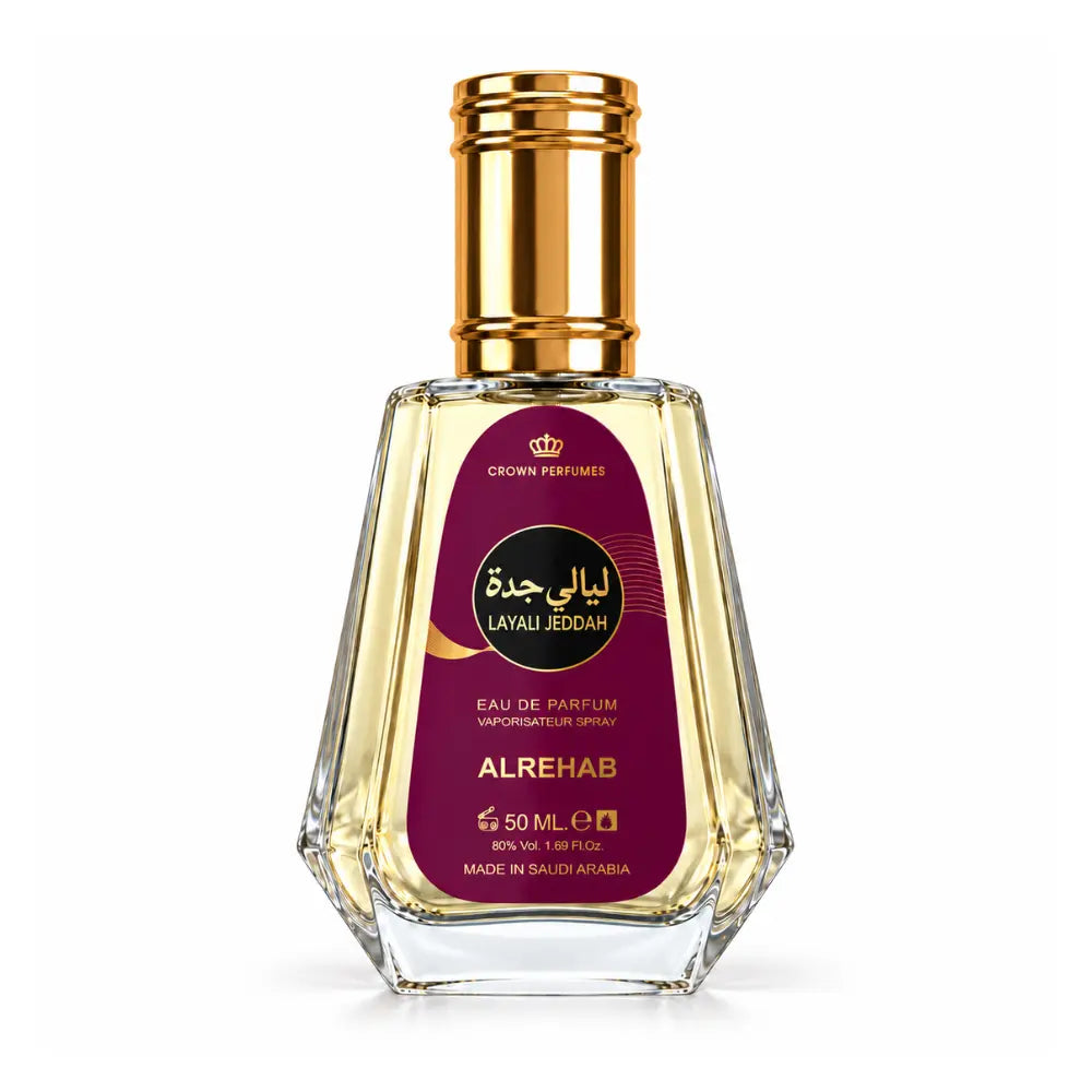 layali jeddah perfume bottle of Alrehab Al perfume by Crown Perfumes, featuring a faceted clear glass bottle with golden liquid, a metallic gold cap, and a deep magenta label with gold and black text.