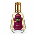 layali jeddah perfume bottle of Alrehab Al perfume by Crown Perfumes, featuring a faceted clear glass bottle with golden liquid, a metallic gold cap, and a deep magenta label with gold and black text.